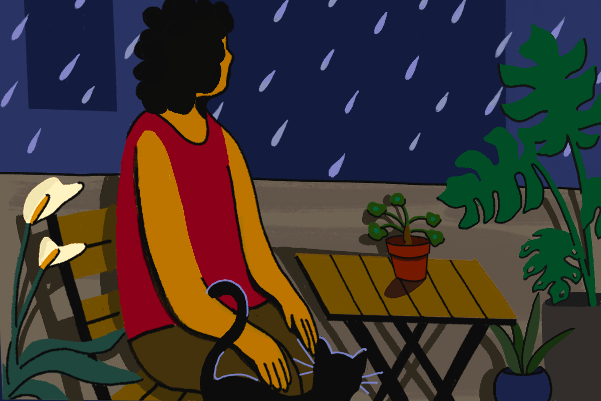 An illustration of person sitting on a chair, next to a wooden outdoor table and standing black cat. They are surrounded by pot plants and staring at the rain.